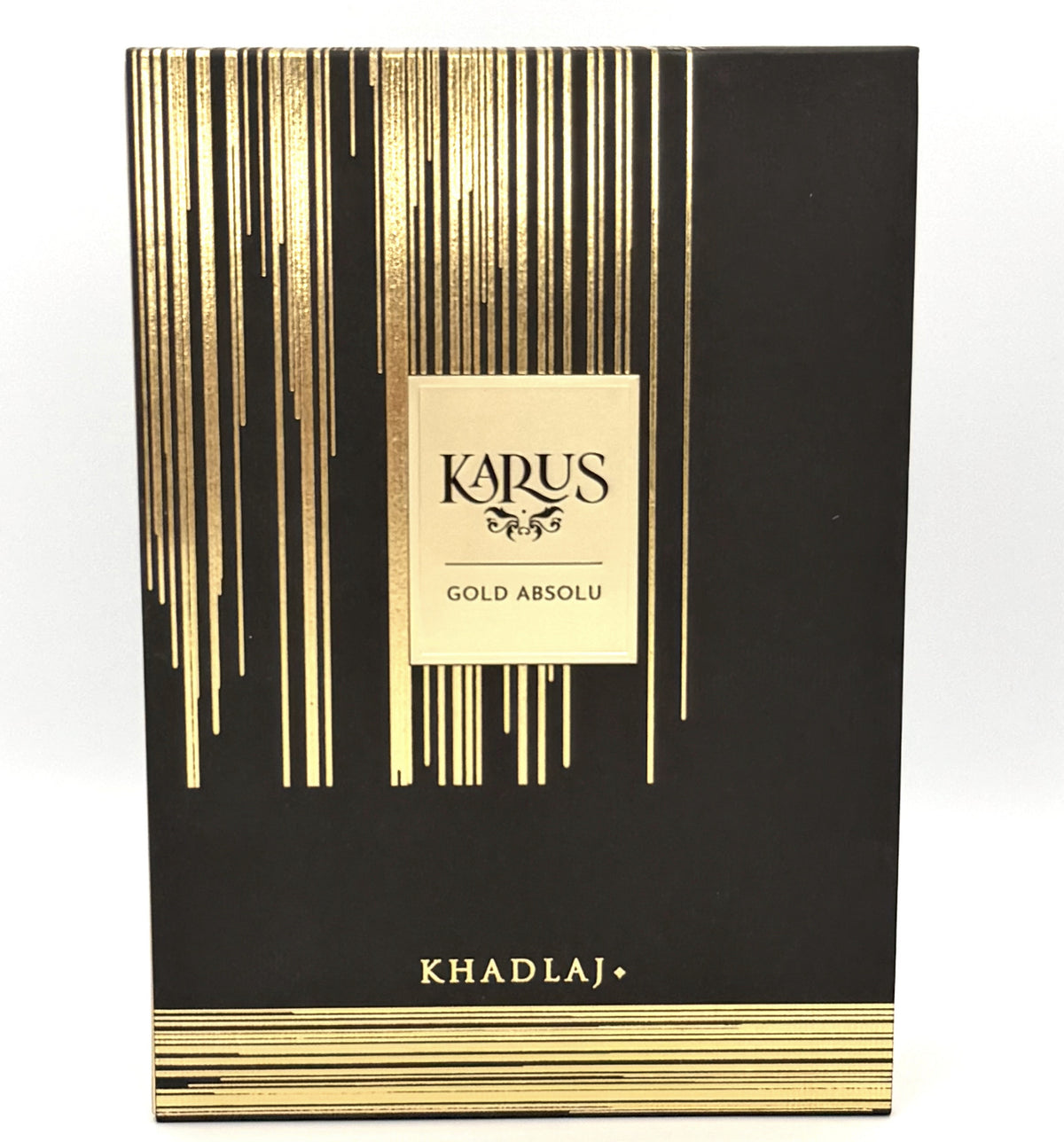 KARUS Gold Absolu Khadlj+ fragrance packaging box, featuring a black background with elegant gold vertical stripes and a central gold label.