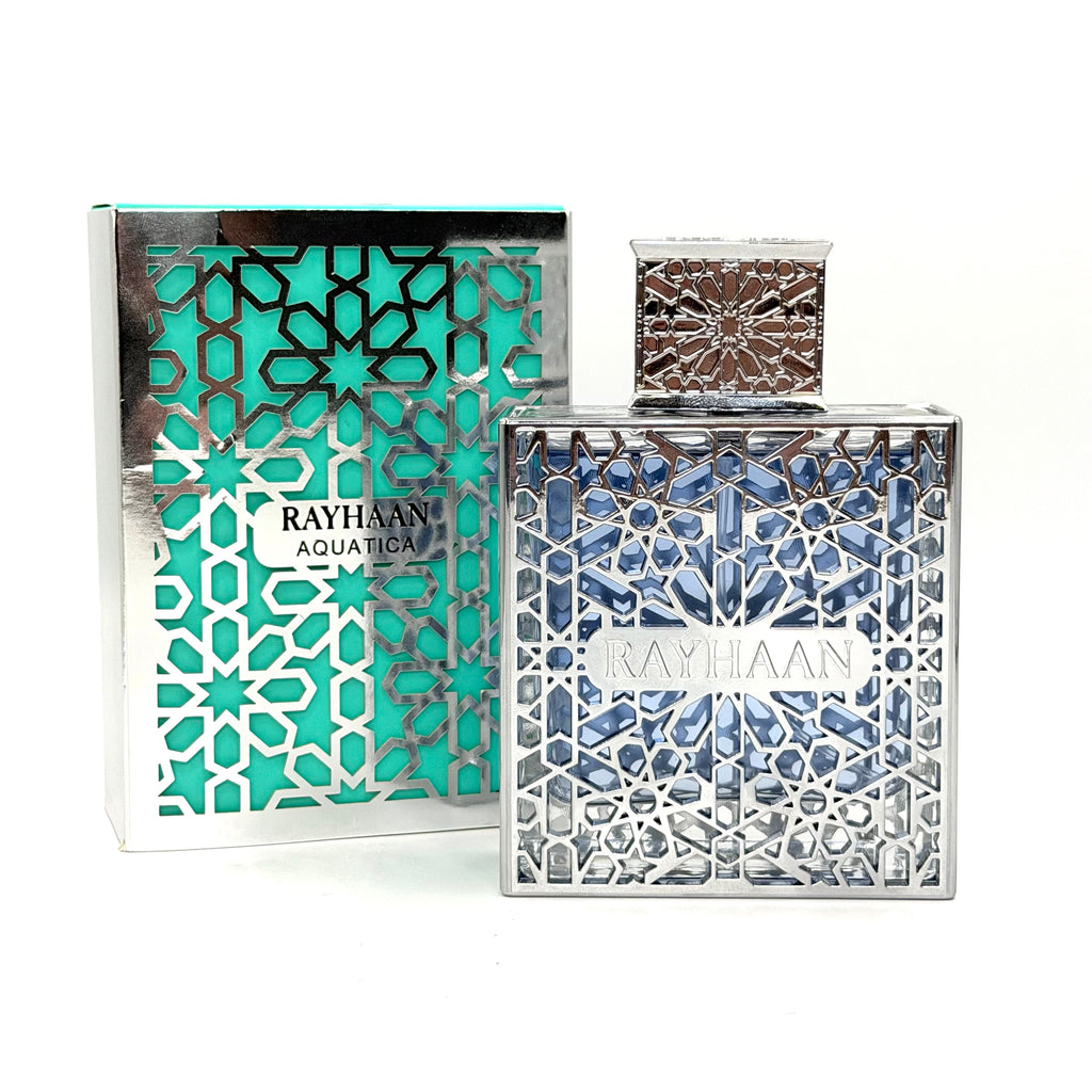 Rayhaan Aquatical perfume bottle and its matching outer packaging box, both decorated with intricate silver geometric cutouts over a turquoise and blue background.
